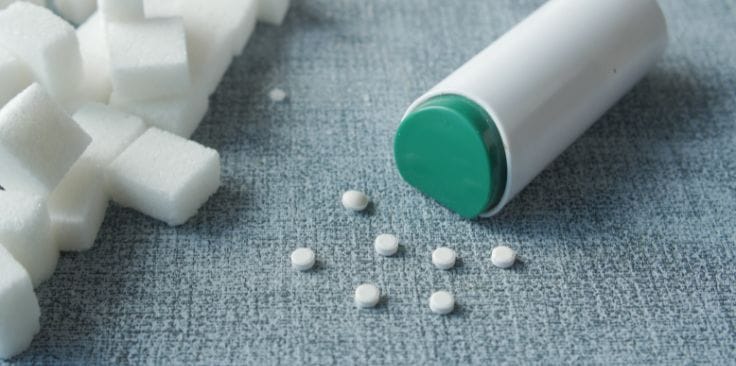 Artificial sweetener tablets with sugar cubes.