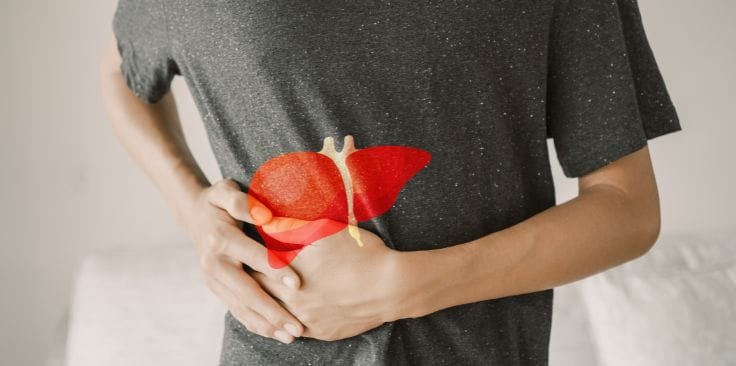 Person holding their side with an illustration of the liver; keyphrase: what disqualifies you from a liver transplant.